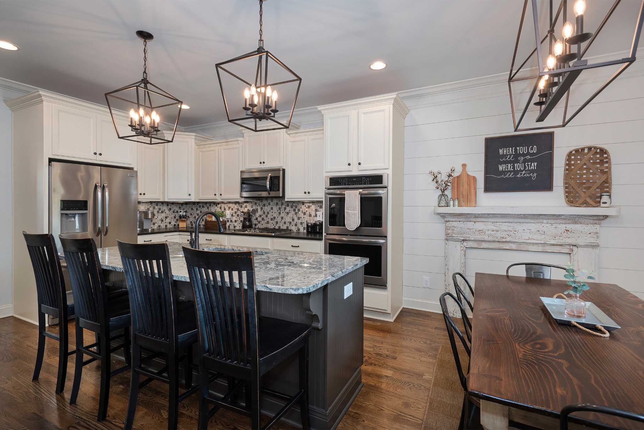 209 Ridgeview Preserve Drive Mount Juliet, TN 37122 - Photo 8 of 46 a view of a dining room with furniture a chandelier and wooden floor