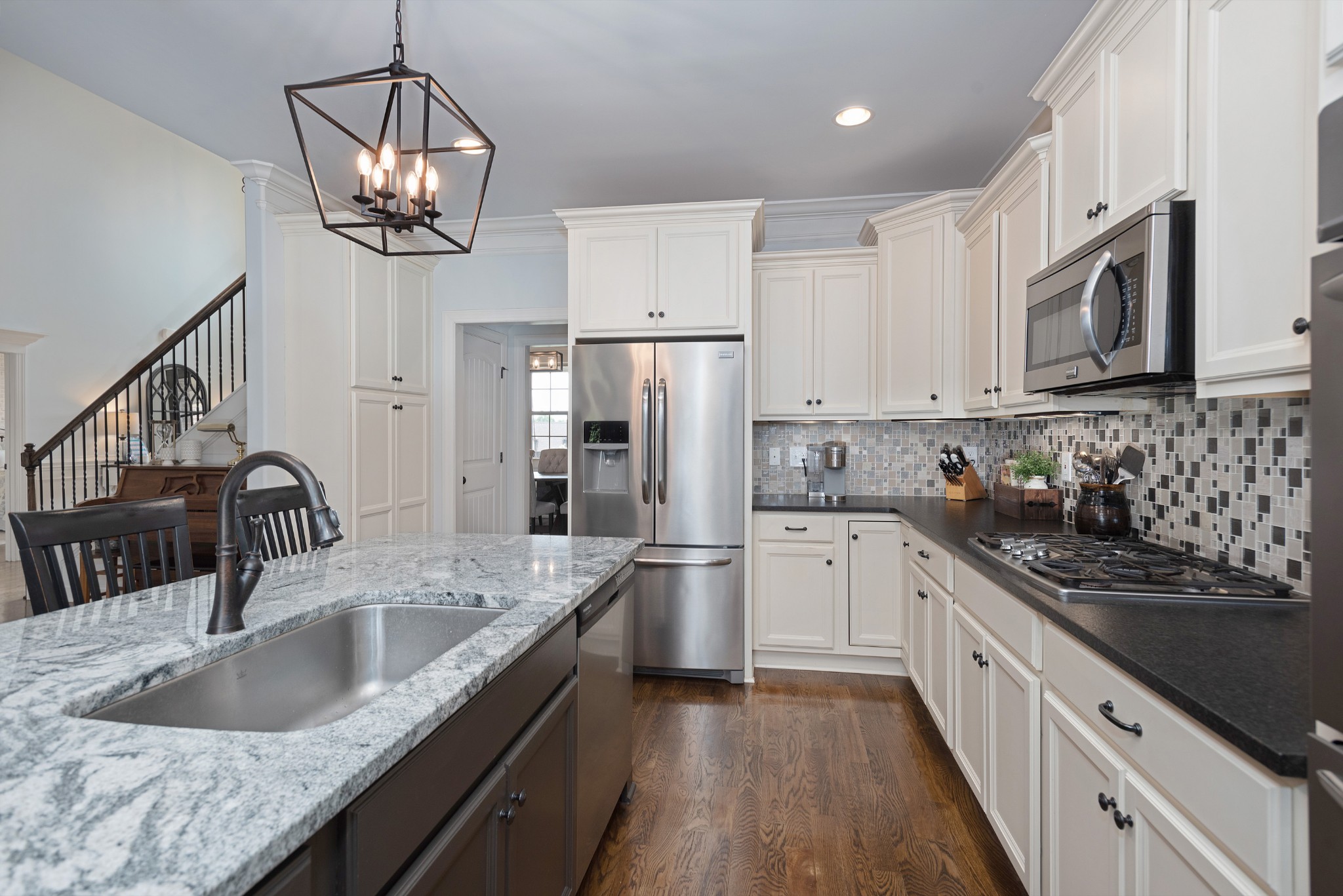 209 Ridgeview Preserve Drive Mount Juliet, TN 37122 - Photo 9 of 46 a kitchen with stainless steel appliances granite countertop a sink stove and refrigerator