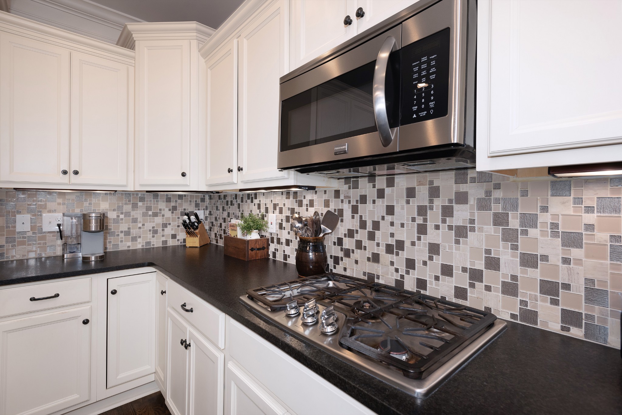 209 Ridgeview Preserve Drive Mount Juliet, TN 37122 - Photo 10 of 46 a kitchen with stainless steel appliances a stove a microwave a sink and cabinets