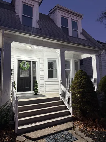 a view of a house with a small porch