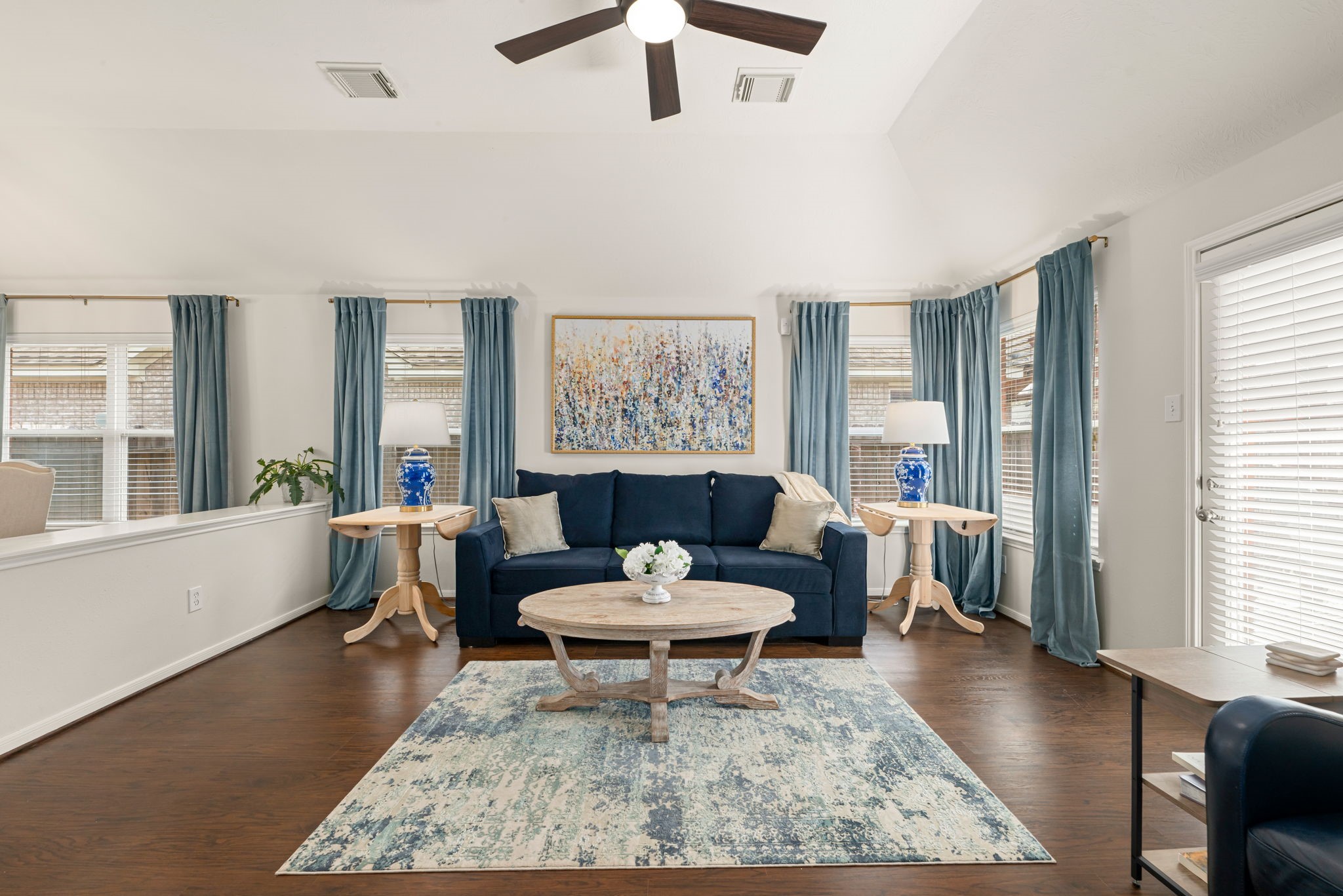 20707 Sapphire Lake Road Richmond, TX 77407 - Photo 10 of 18 Family room with wood-look laminate floors, updated light/fan fixture and high ceilings.