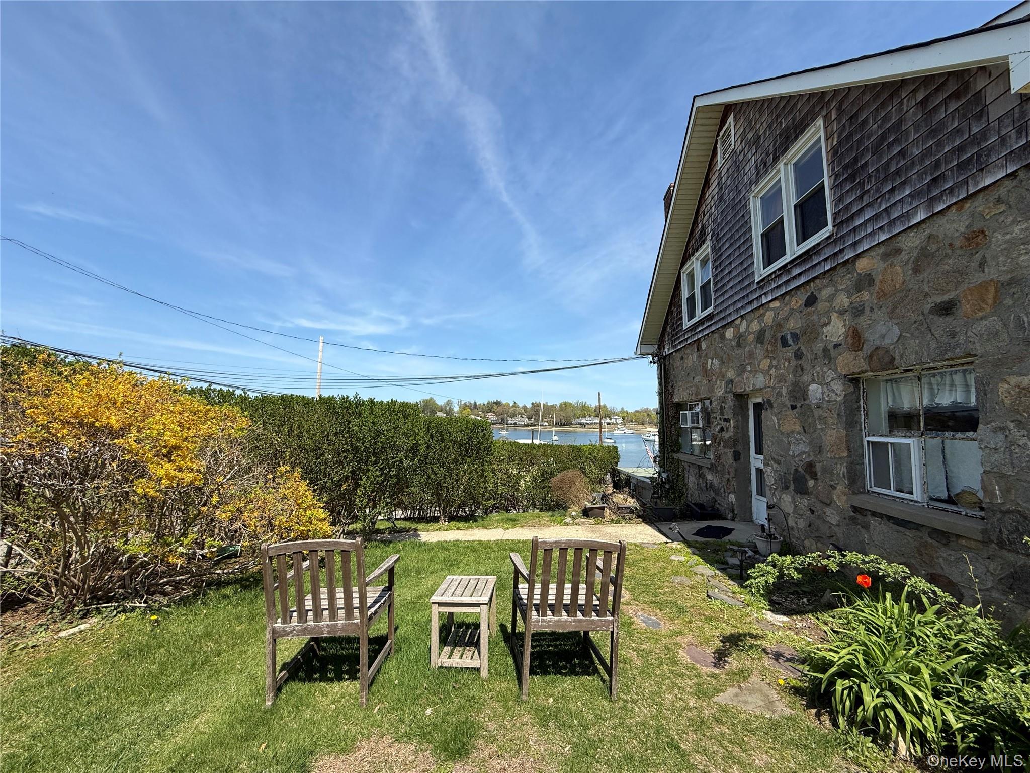 293 West Shore Road, Unit 4 Huntington, NY 11743 - Photo 12 of 13 a view of a chairs and table in the balcony