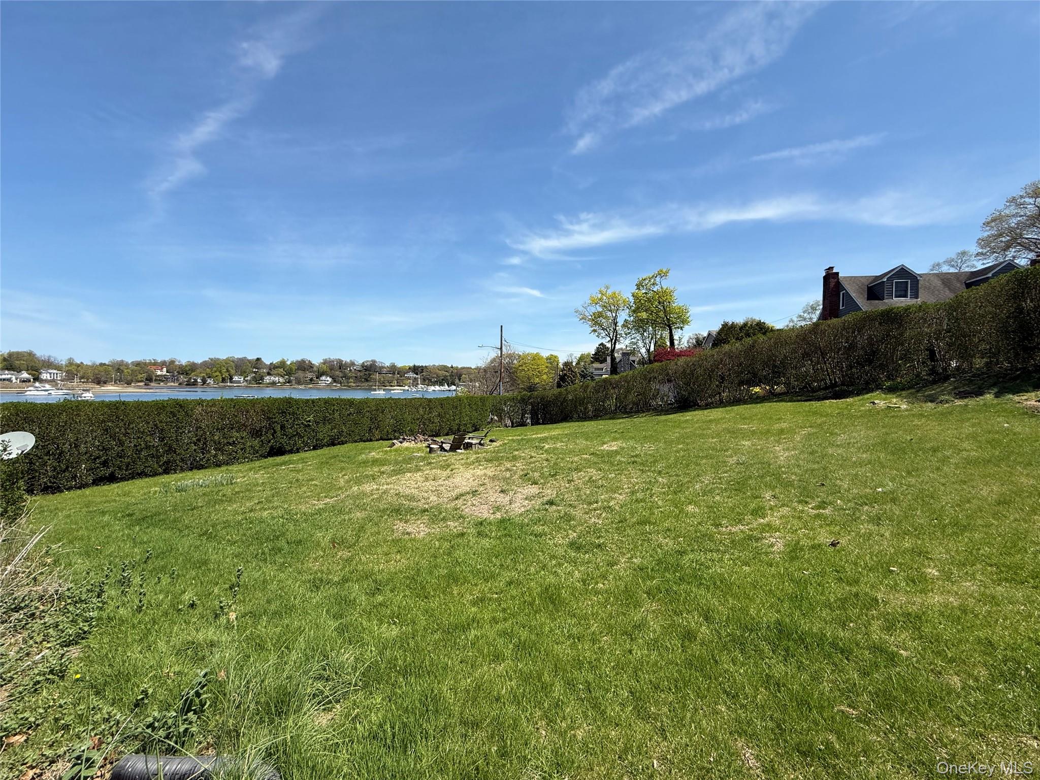 293 West Shore Road, Unit 4 Huntington, NY 11743 - Photo 13 of 13 a view of a lake with houses in the background