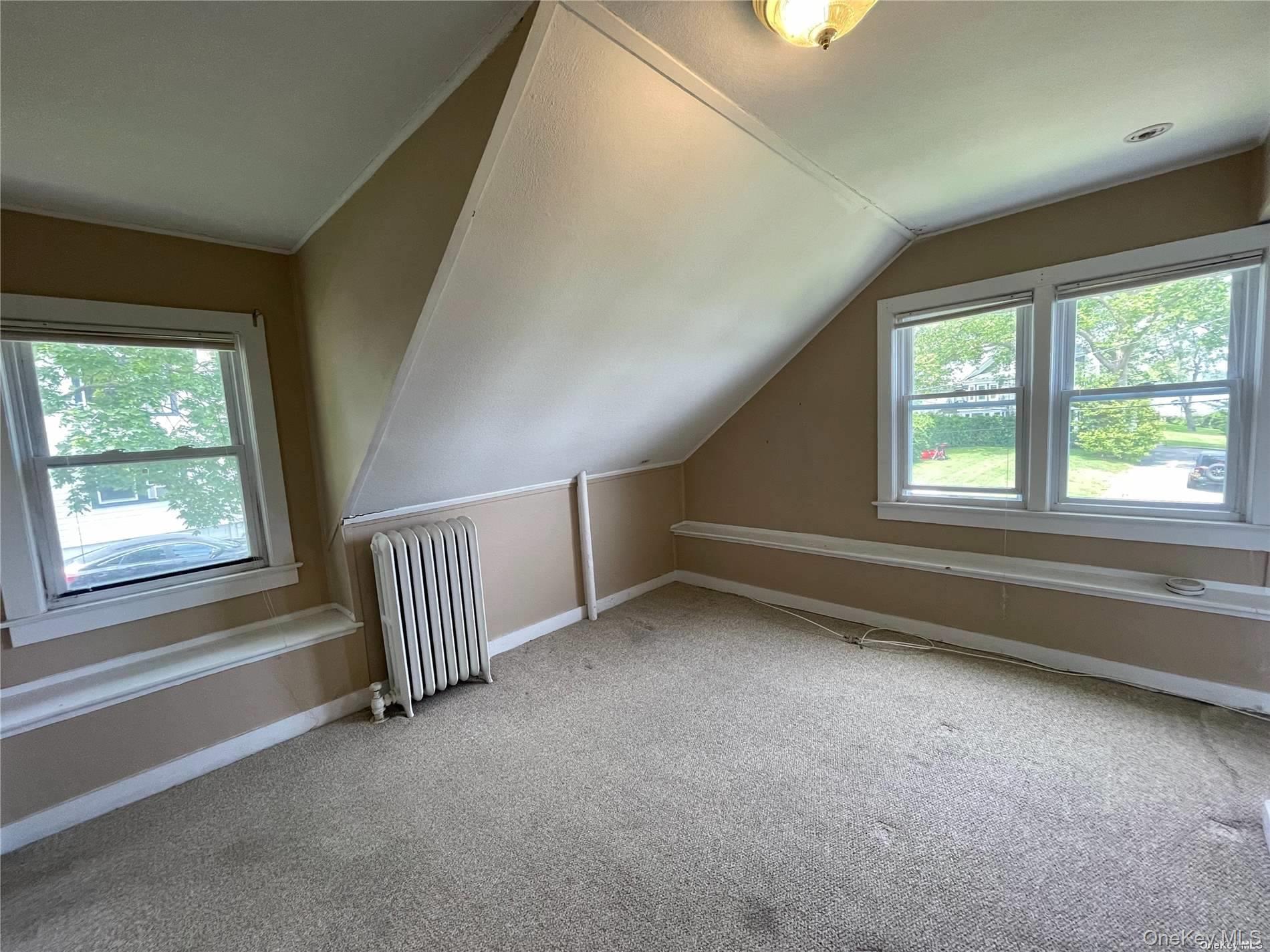 293 West Shore Road, Unit 4 Huntington, NY 11743 - Photo 8 of 13 a view of an empty room with a window