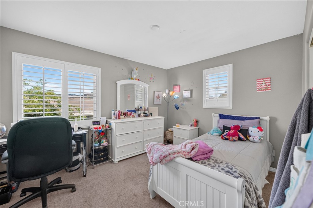23347 Crystal Way Wildomar, CA 92595 - Photo 59 of 109 a bedroom with a bed and a window