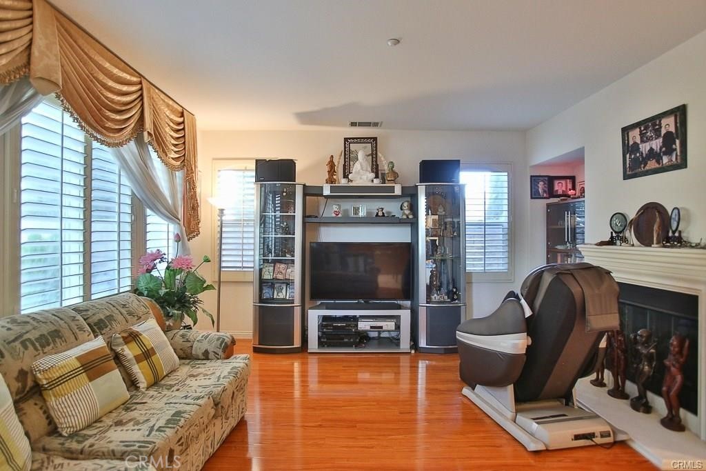 6302 Lavender Way Westminster, CA 92683 - Photo 11 of 38 a living room with furniture and a flat screen tv