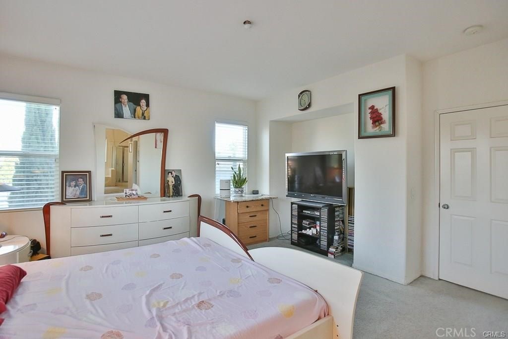 6302 Lavender Way Westminster, CA 92683 - Photo 19 of 38 a bedroom with a bed and furniture