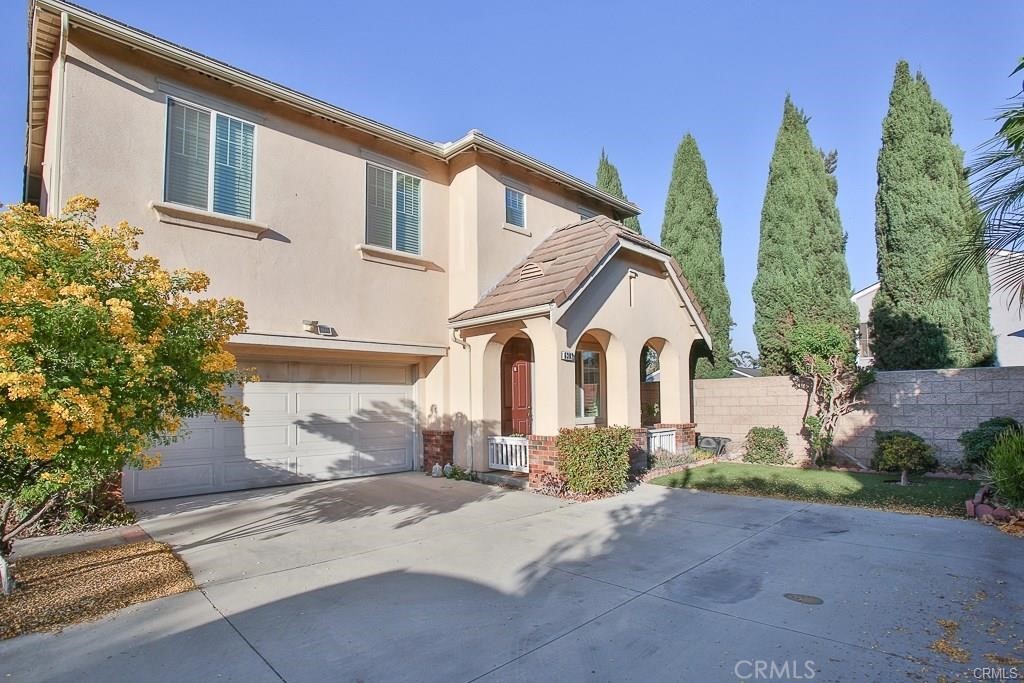 6302 Lavender Way Westminster, CA 92683 - Photo 2 of 38 a front view of a house with a yard and garage