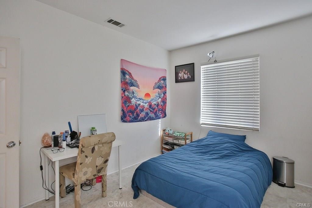 6302 Lavender Way Westminster, CA 92683 - Photo 30 of 38 a bedroom with a bed and furniture