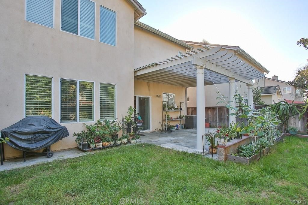 6302 Lavender Way Westminster, CA 92683 - Photo 32 of 38 a view of a chair and table in backyard of the house