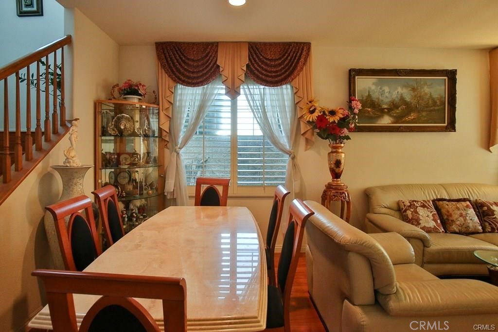 6302 Lavender Way Westminster, CA 92683 - Photo 8 of 38 a view of a dining room with furniture and chandelier