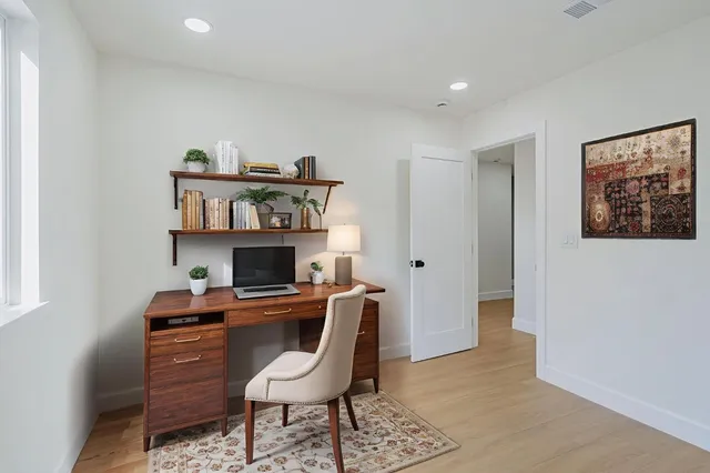 a bathroom with a double vanity sink mirror and shower
