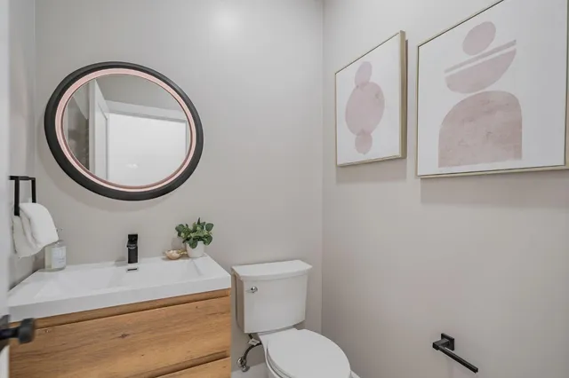 a front view of a house with a yard and a garage