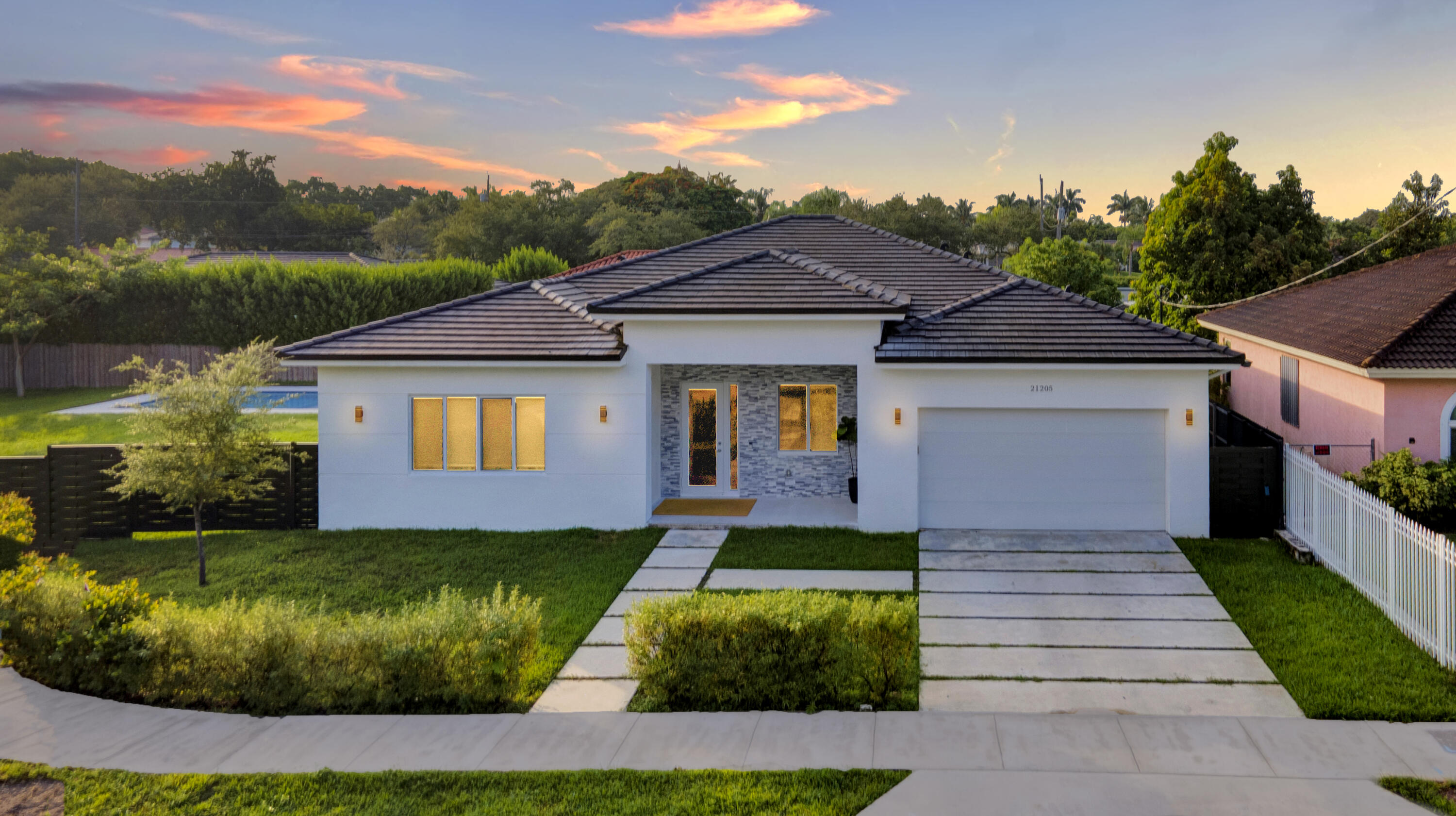 a front view of a house with a yard