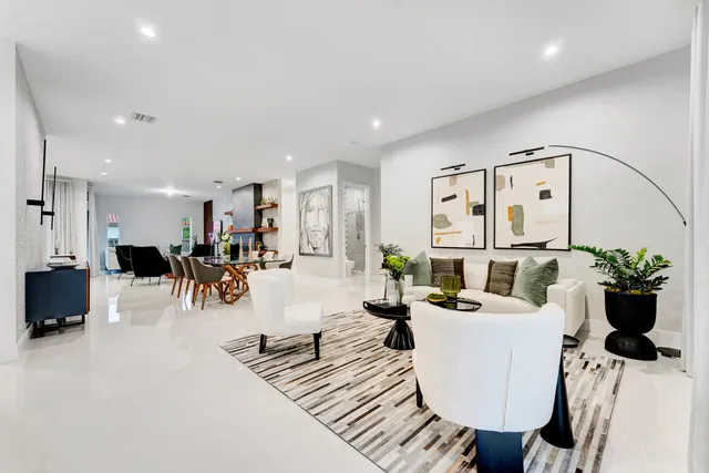 a living room with furniture and white walls