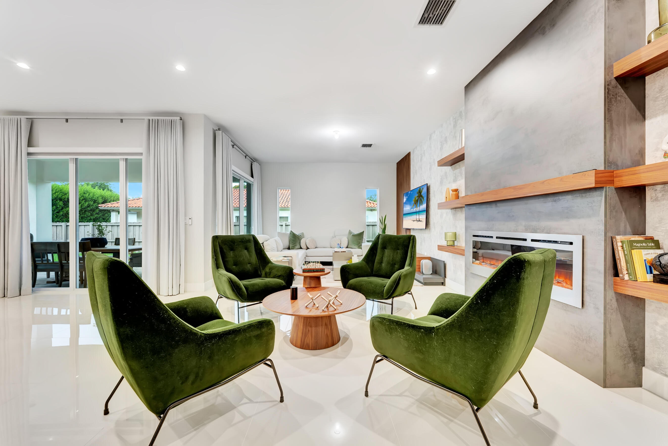 21205 Ingraham Ave Road Cutler Bay, FL 33189 - Photo 16 of 45 a living room with furniture a rug and a fireplace