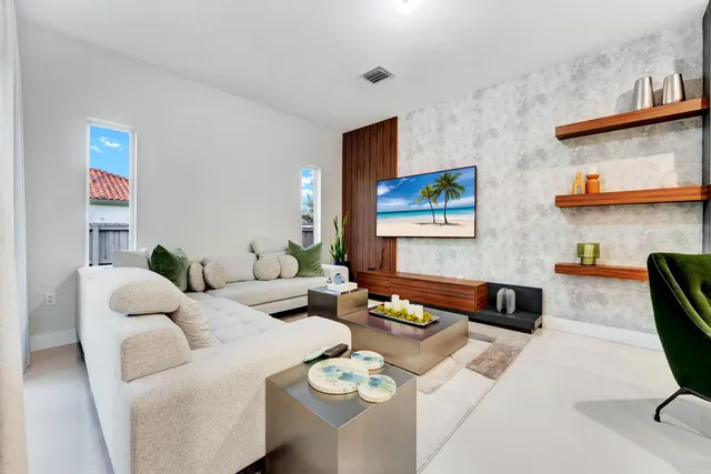 a living room with furniture and a lamp