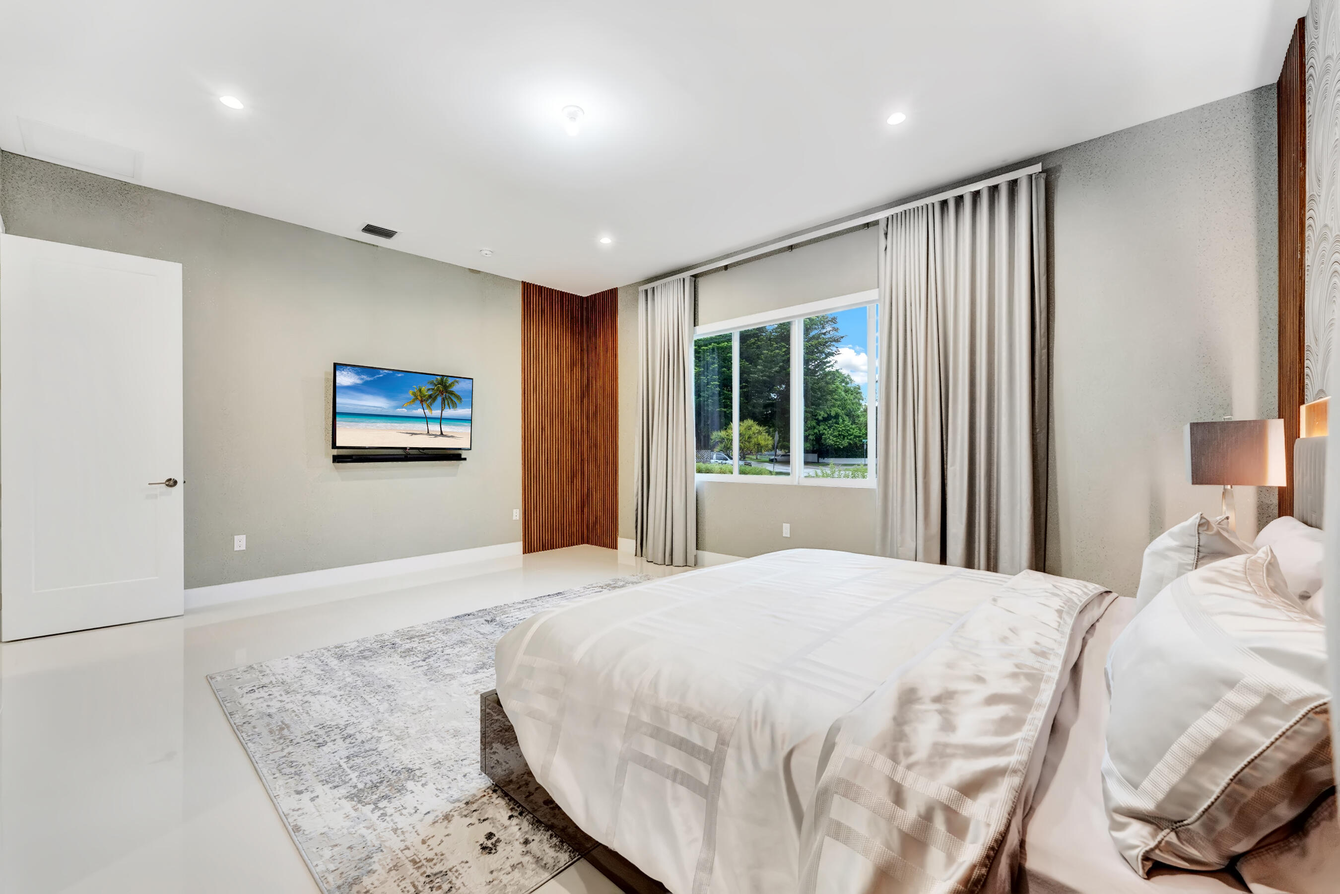 21205 Ingraham Ave Road Cutler Bay, FL 33189 - Photo 24 of 45 a bedroom with a large bed and a window