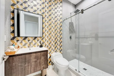 a bathroom with a toilet and shower