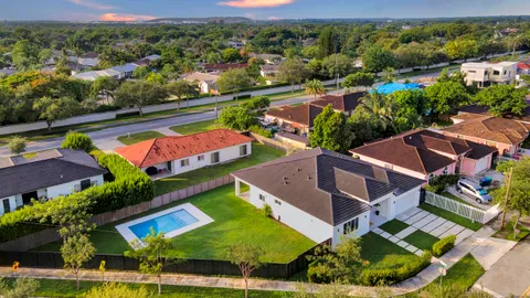 an aerial view of a house with a garden