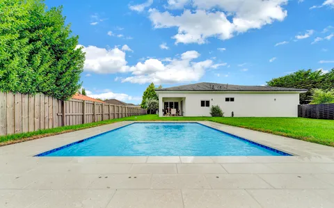 a view of outdoor space yard and swimming pool