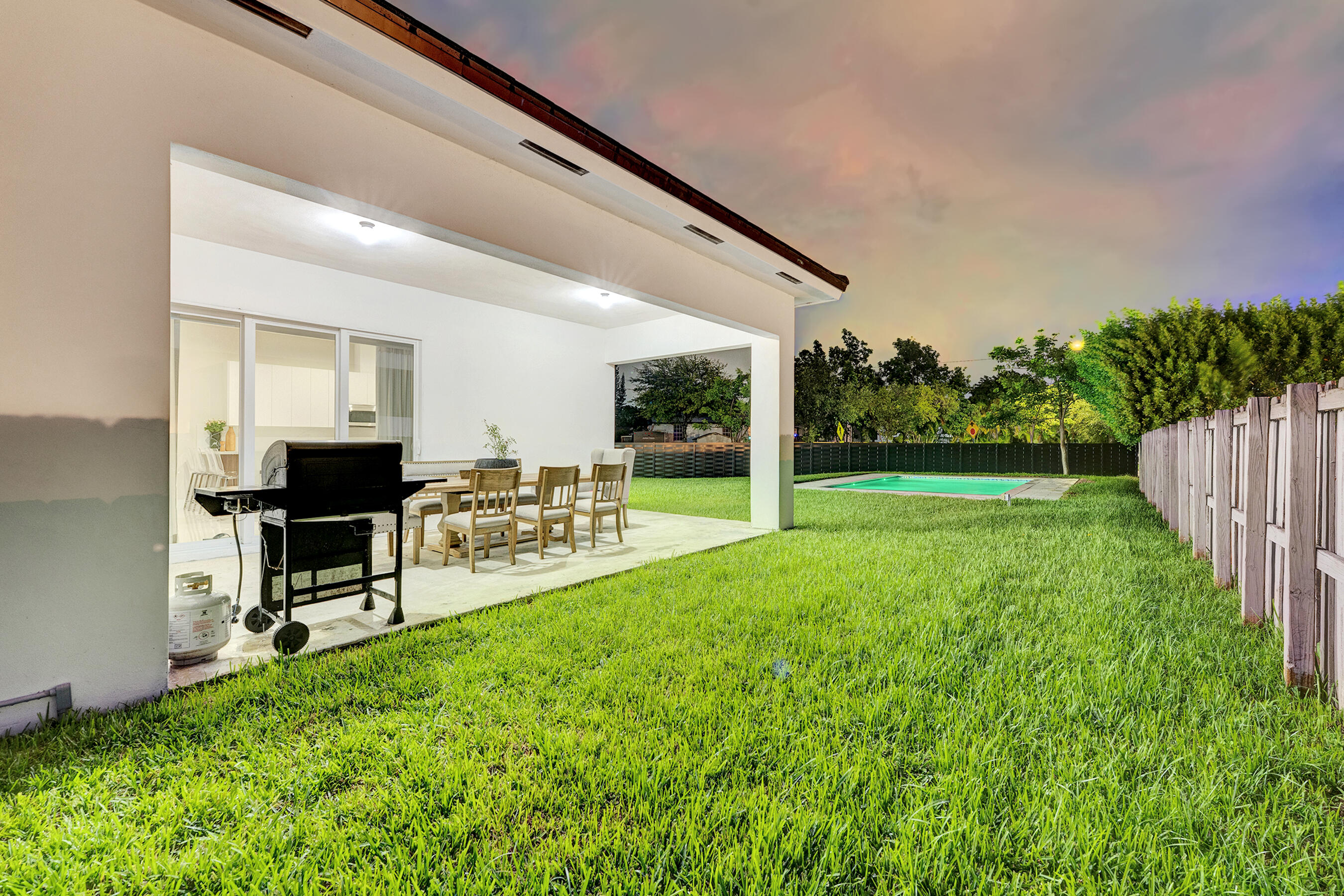 21205 Ingraham Ave Road Cutler Bay, FL 33189 - Photo 45 of 45 a view of a backyard with furniture and garden