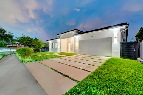 a view of backyard with a garden and plants