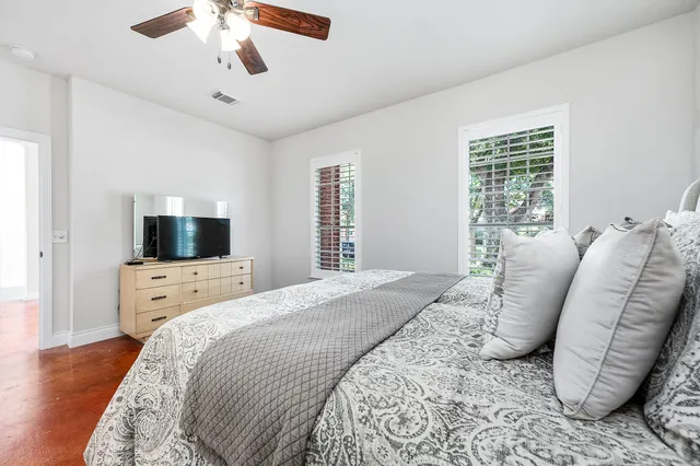 a bedroom with a bed and a couch