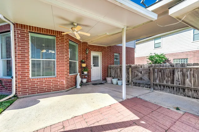 a front view of a house with a garden and yard