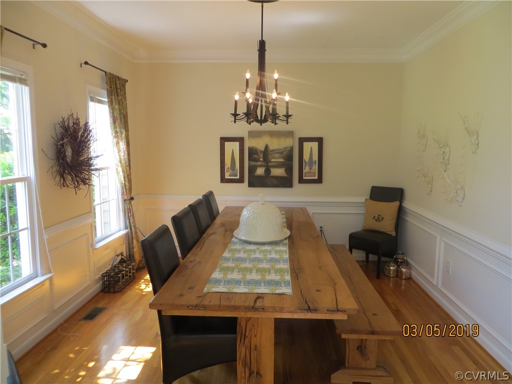822 Club Ridge Terrace Chester, VA 23836 - Photo 4 of 28 a view of a dining room with furniture and a chandelier