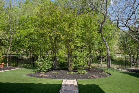a view of a park with large trees