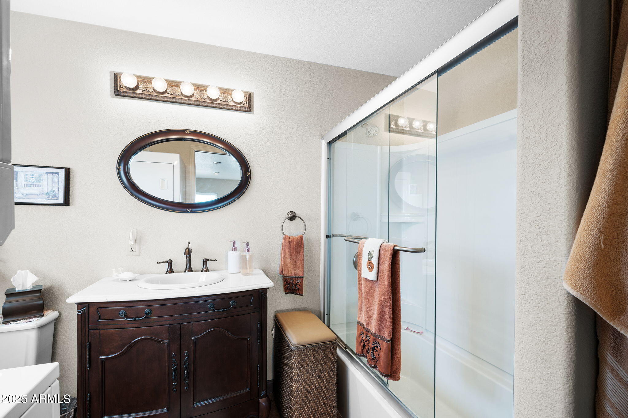 111 South Greenfield Road, Unit 588 Mesa, AZ 85206 - Photo 11 of 16 a bathroom with a sink a mirror and a toilet