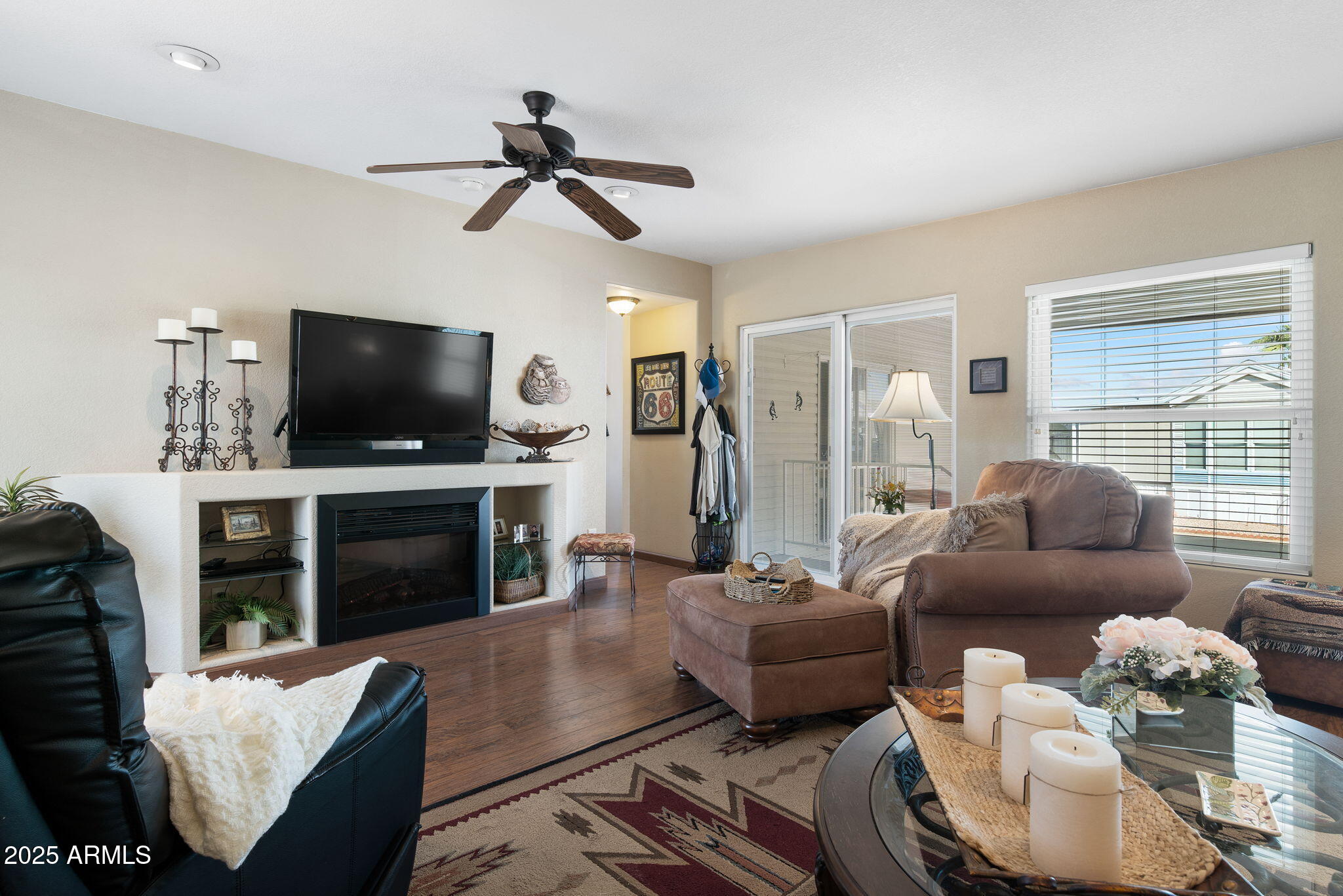 111 South Greenfield Road, Unit 588 Mesa, AZ 85206 - Photo 2 of 16 a living room with furniture and a flat screen tv