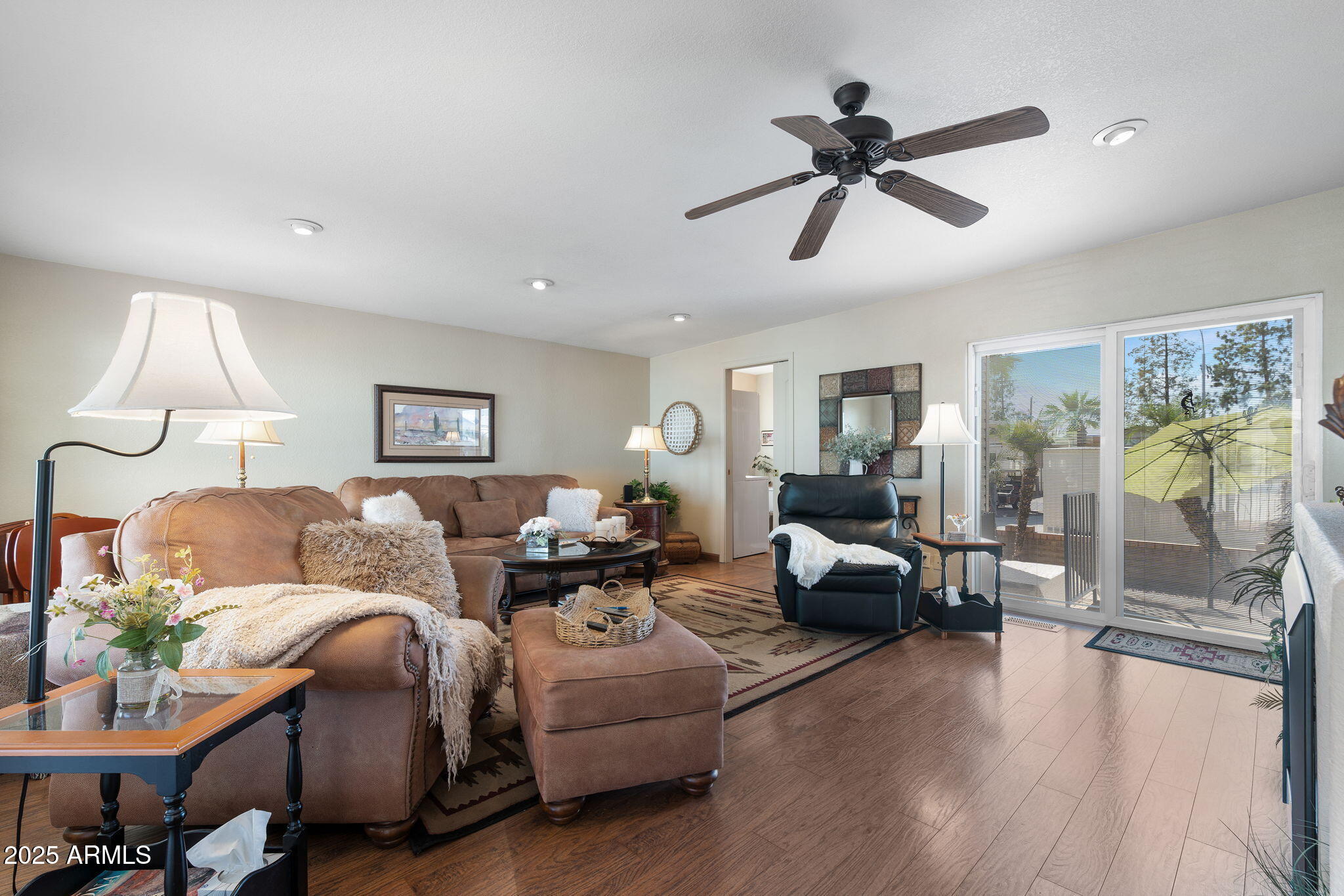 111 South Greenfield Road, Unit 588 Mesa, AZ 85206 - Photo 4 of 16 a living room with furniture and a large window