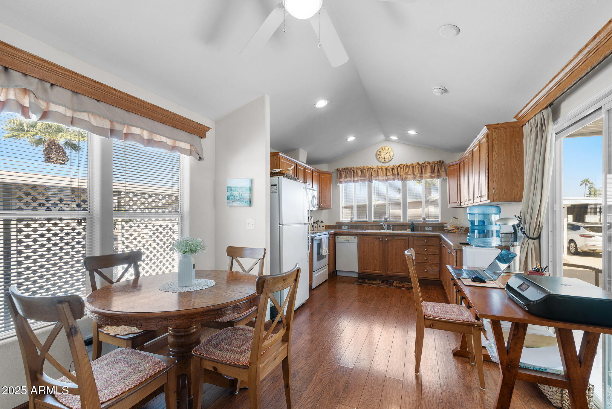 111 South Greenfield Road, Unit 588 Mesa, AZ 85206 - Photo 5 of 16 a dining room with furniture and wooden floor