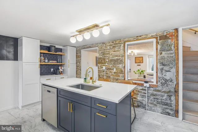 a kitchen with a sink and cabinets