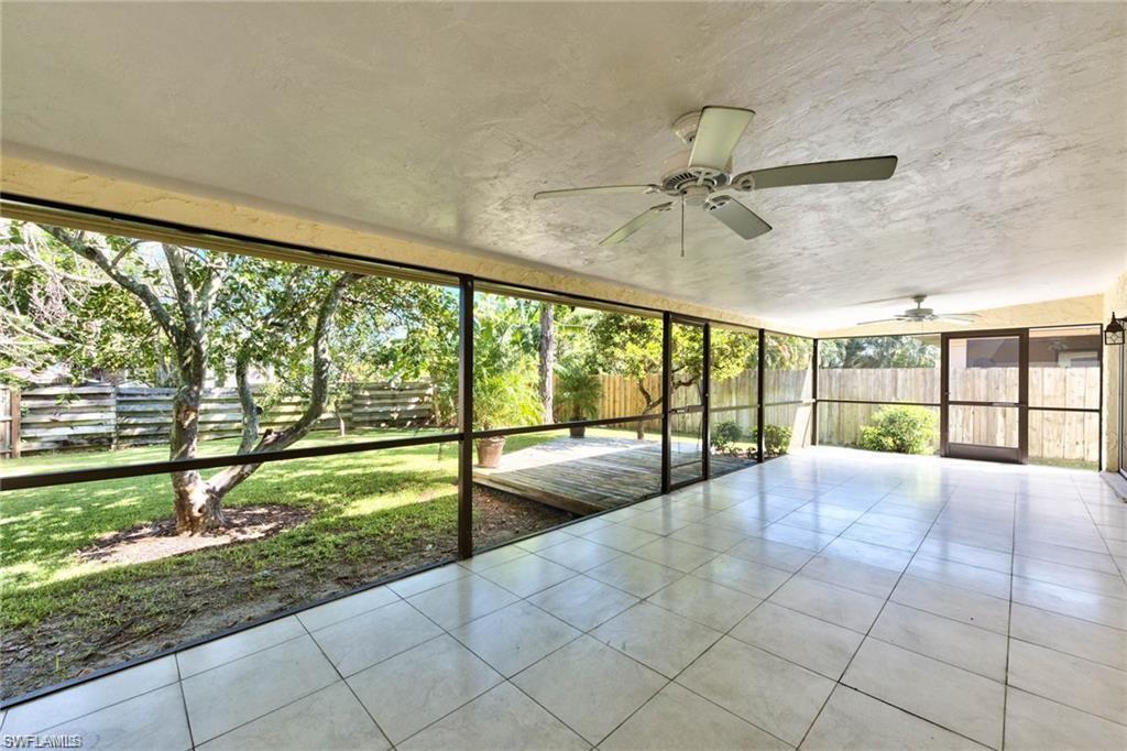 671 98th Avenue North Naples, FL 34108 - Photo 22 of 27 a view of an empty room with a large window