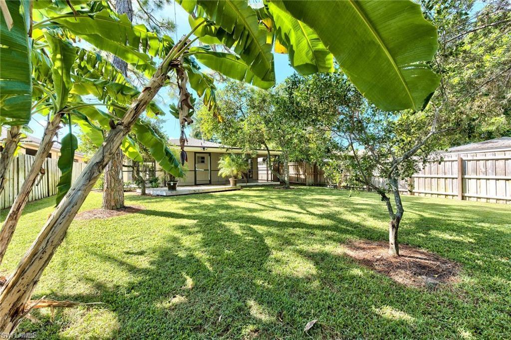 671 98th Avenue North Naples, FL 34108 - Photo 25 of 27 a view of a house with a yard