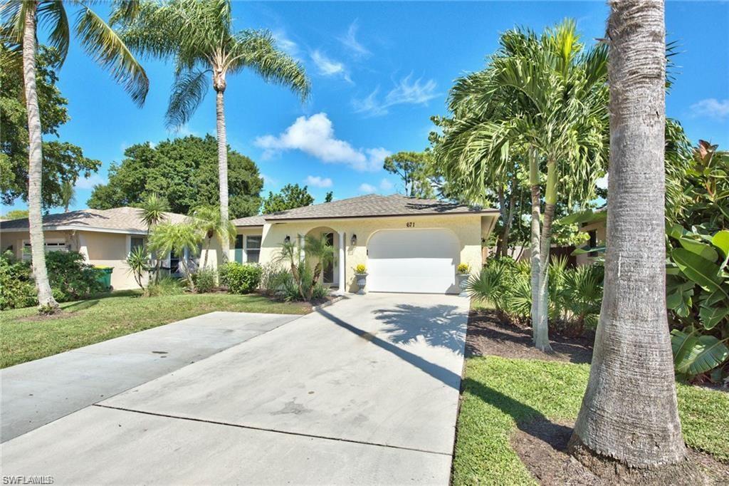 671 98th Avenue North Naples, FL 34108 - Photo 26 of 27 a view of a house with a garden