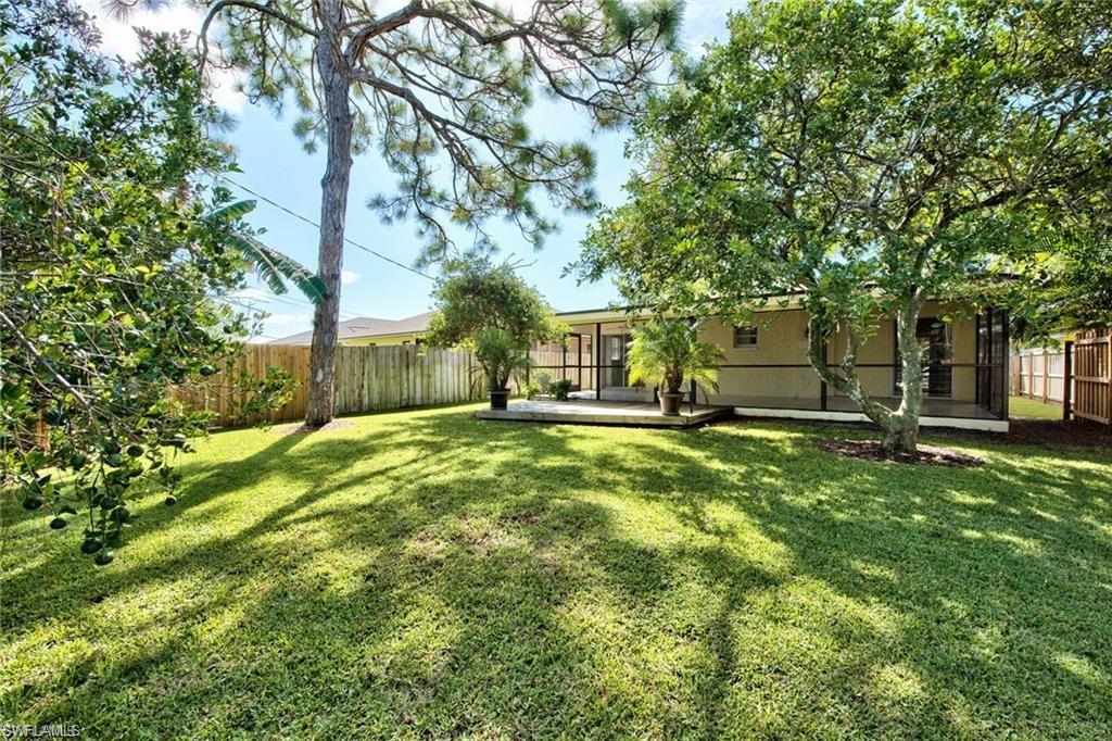 671 98th Avenue North Naples, FL 34108 - Photo 3 of 27 a view of a house with a yard