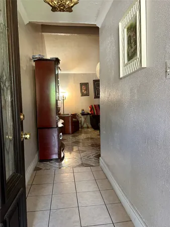 a view of a hallway with dining area