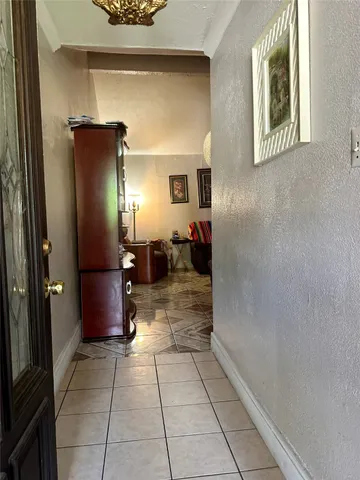a view of a hallway with dining area