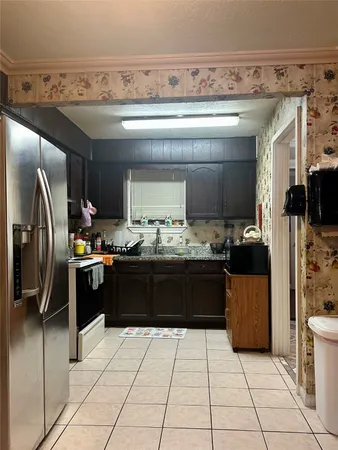 a kitchen with a sink counter top space and appliances