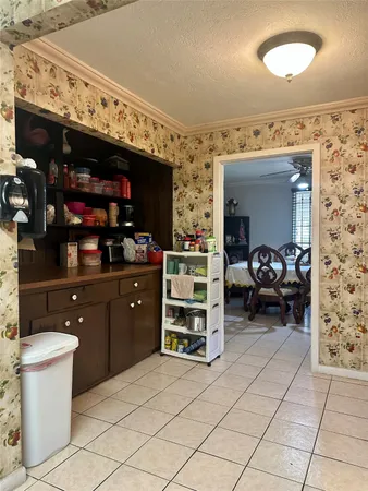 a kitchen with furniture and cabinets