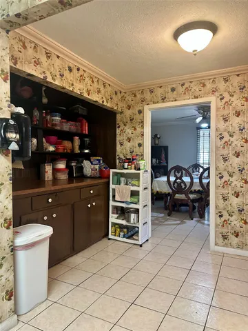 a kitchen with furniture and cabinets
