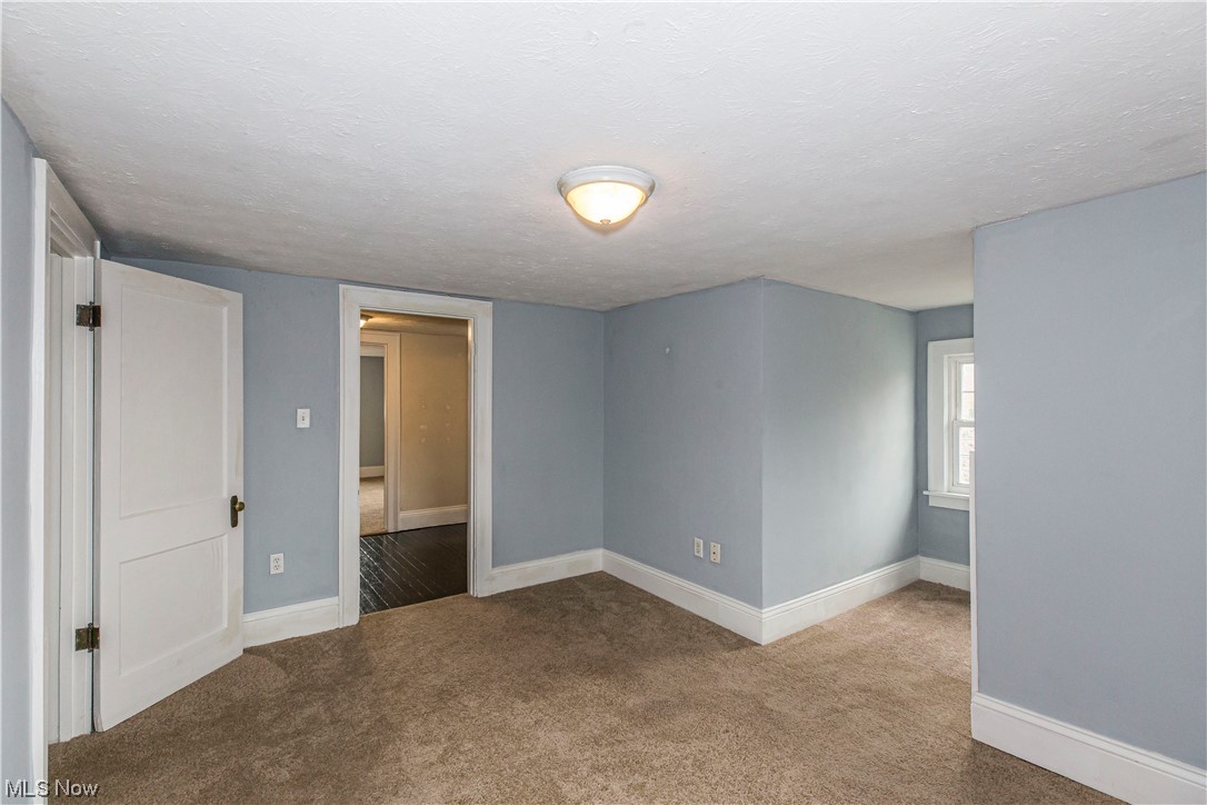 646 Copley Road Akron, OH 44320 - Photo 27 of 32 Carpeted empty room with a textured ceiling