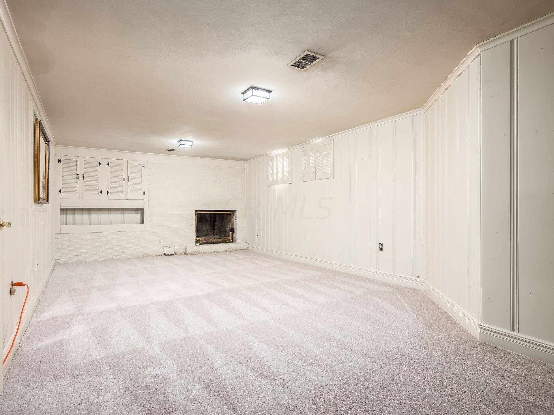 2674 Fishinger Road Upper Arlington, OH 43221 - Photo 21 of 33 Lower level family room with wood burning fireplace.