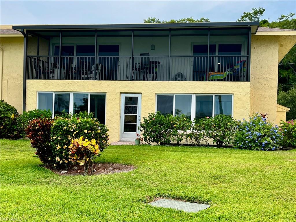 348 Tern Drive, Unit 4 Naples, FL 34112 - Photo 17 of 26 a view of a house with garden