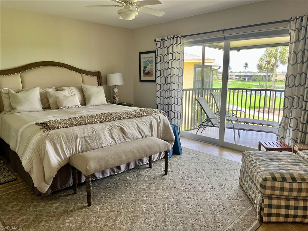 348 Tern Drive, Unit 4 Naples, FL 34112 - Photo 8 of 26 a bedroom with a bed and a night stand