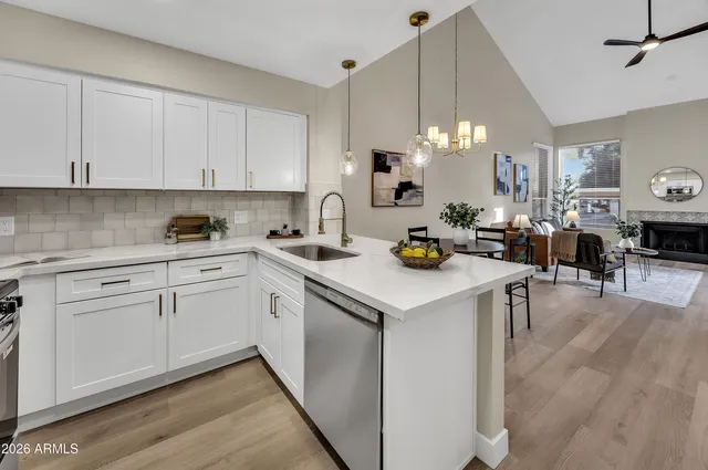 a kitchen with a sink cabinets and window